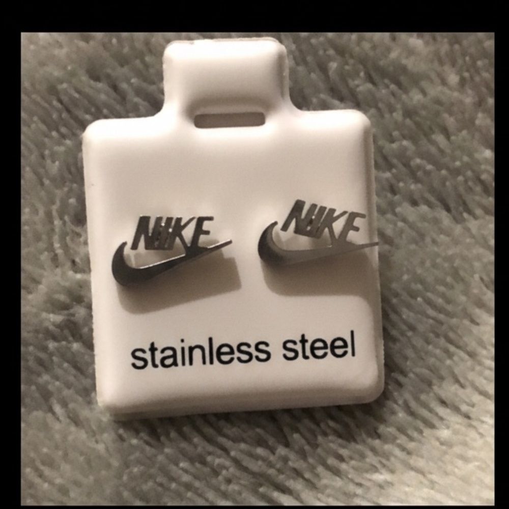 Nike silver stainless steel Logo Earrings. Never worn